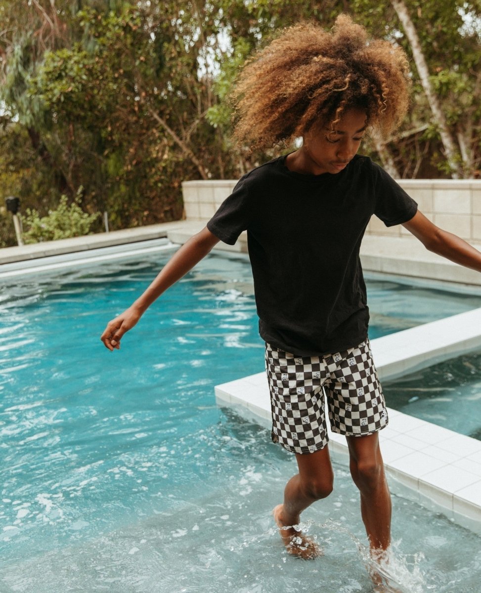 PEANUTS CHECKERED SWIM TRUNKS - SWIM TRUNKS