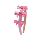 CRYSTALIZED BOW PATENT HEADBAND - HEADBANDS